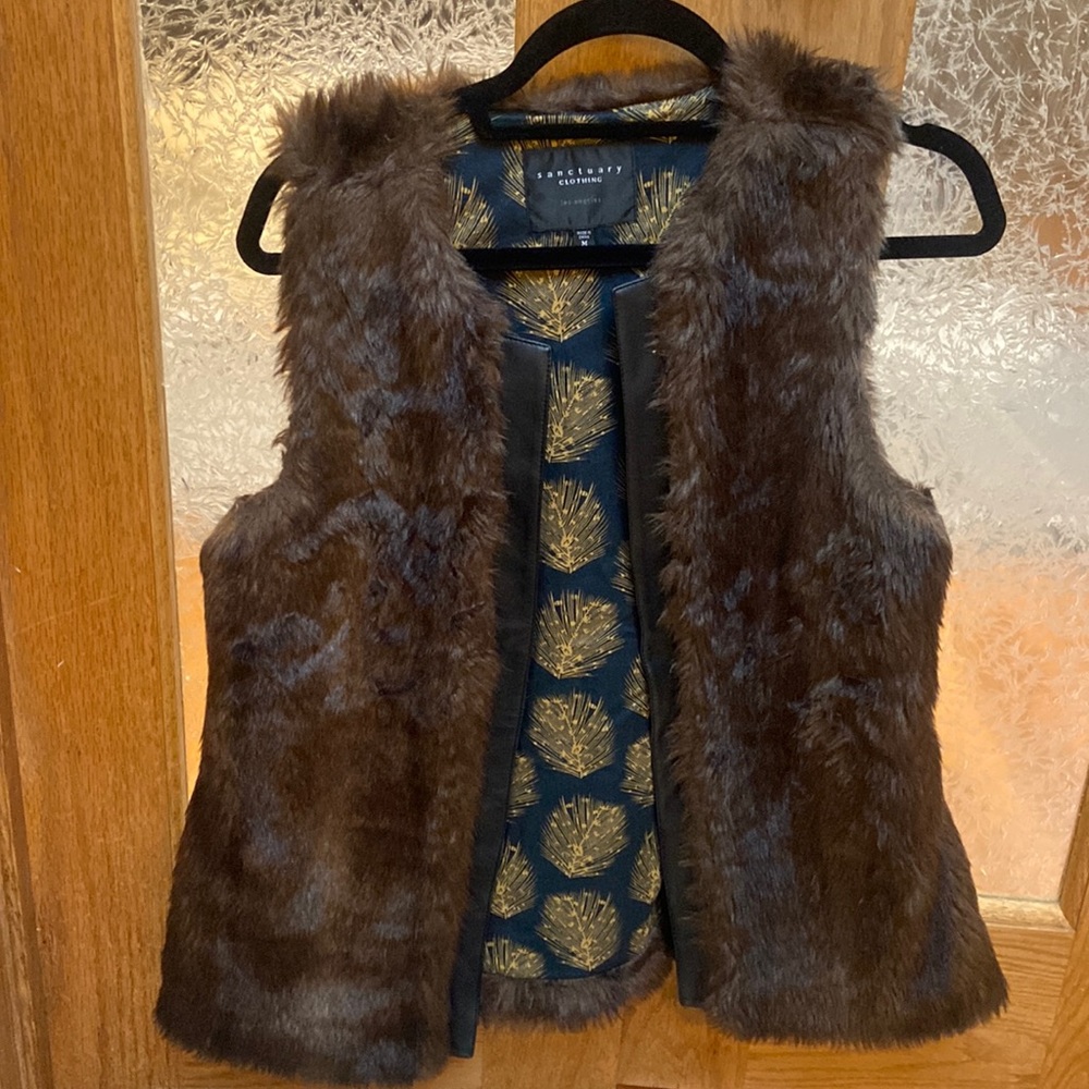 Faux fur vest with leather trim